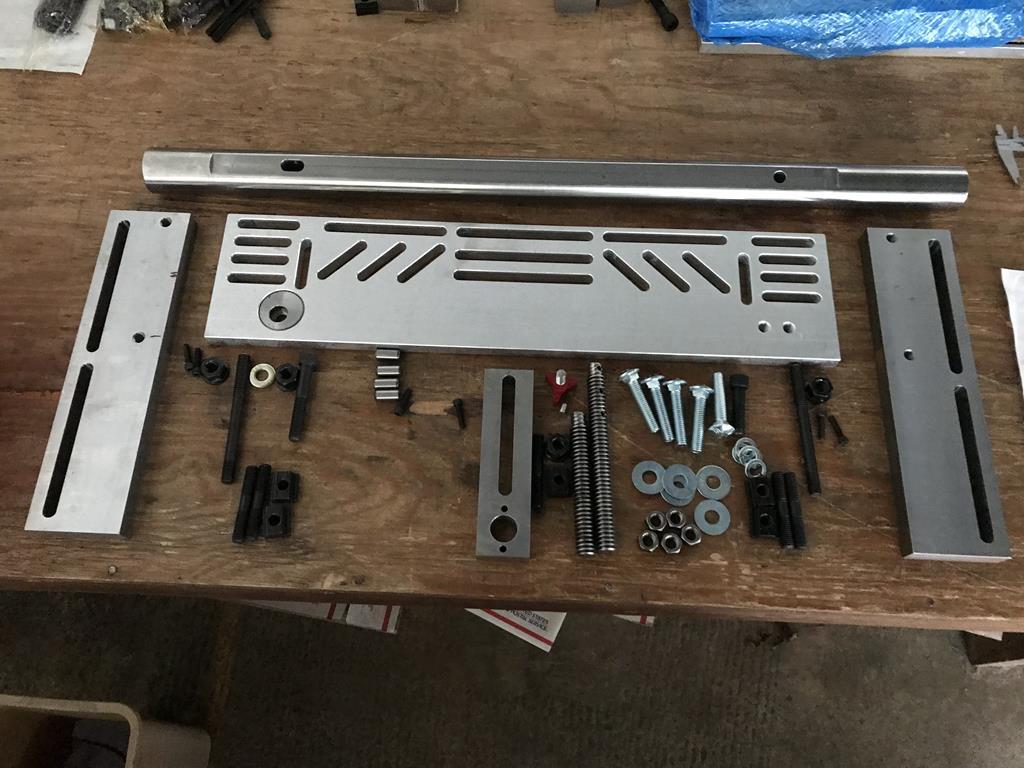 Cylinder head mounting plate for resurfacing machines